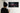 Person looking at a Formula 1 car painting on a wall